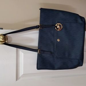 Michael Kors old school navy blue purse. L 12";W 5"; H 11".